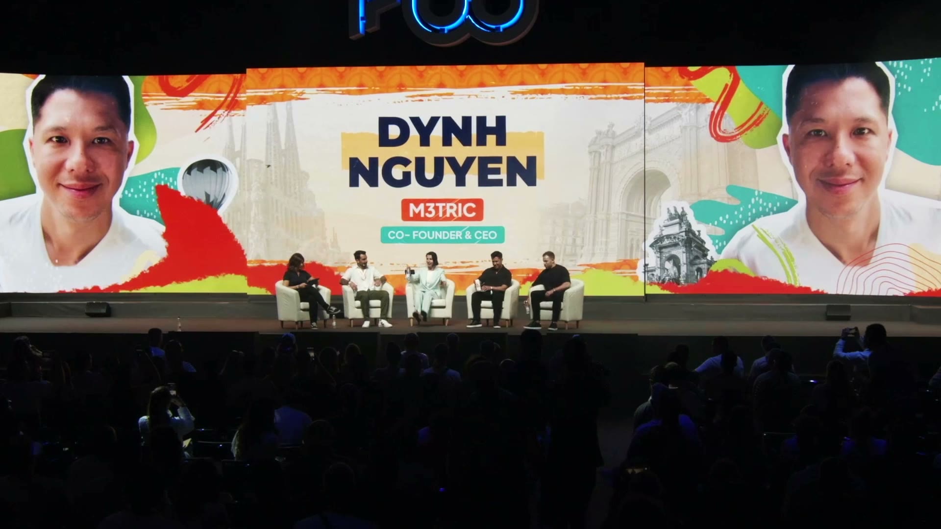 Stage screen billing Dynh Nguyen, M3TRIC co-founder and CEO